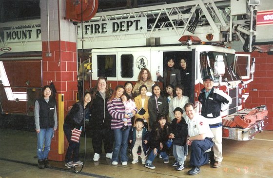 Group picture in front of the fire truck